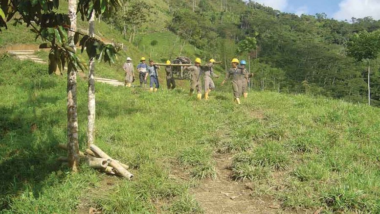 Workers carry drilling equipment at U308 Corp.'s Berlin uranium project in Colombia. Source: U308 Corp.