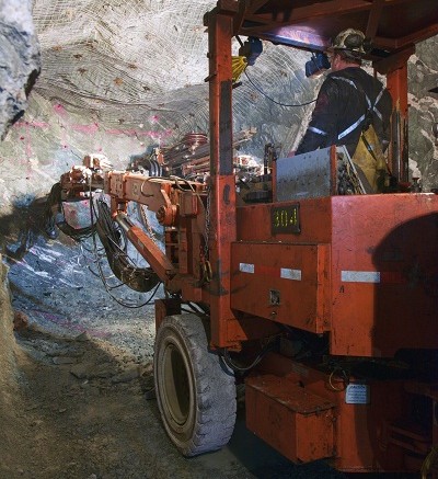 A worker operates a two boom jumbo drill in the Hinge Mine at San Gold's Rice Lake gold mining complex 250 km northeast of Winnipeg, Manitoba. Source: San Gold