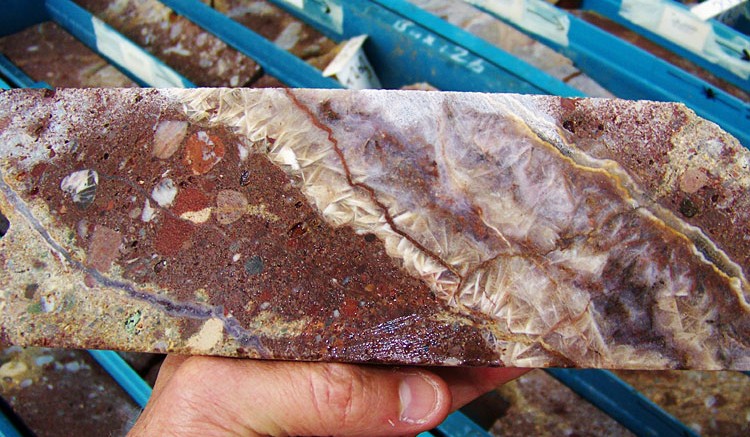 This core specimen reveals some of the typical textures which host gold and silver mineralization at Eurasian's Akarca project, in this case a quartz vein displaying bladed textures within the conglomerate host rock.  Source: Eurasian Minerals