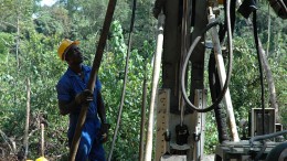 Workers attend to a drill rig at Aureus' New Liberty project in Liberia. Source: Aureus Mining