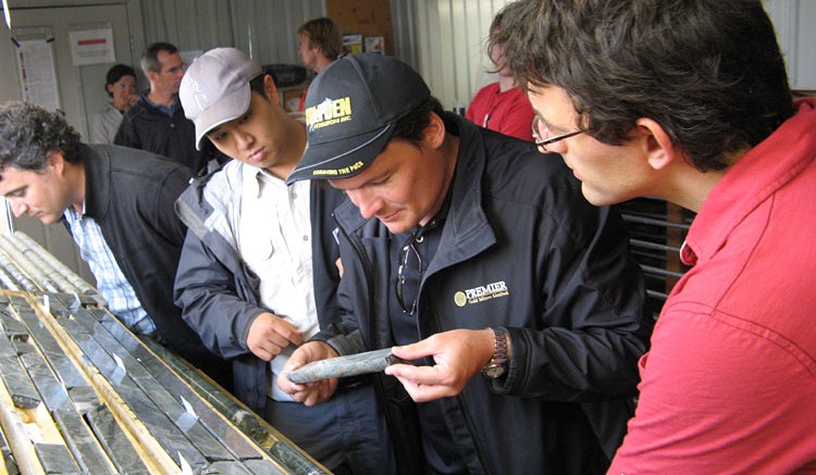 President Ewan Downie examines drill core from the Rahill-Bonanza project in Red Lake. Photo by James Whyte