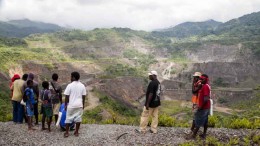 Locals survey the past-producing Panguna copper-gold open pit mine in Bougainville, Papua New Guinea. Photo by Ian Bickis