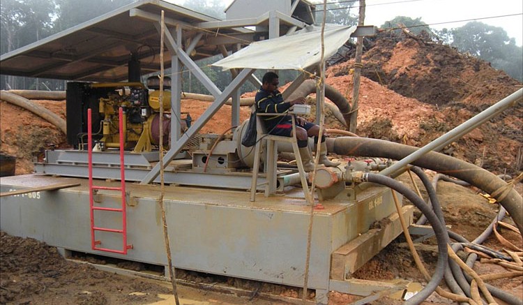 A worker on a dredge pump at Sacre-Coeur Minerals' Million Mountain gold project in Guyana. Source: Sacre-Coeur Minerals