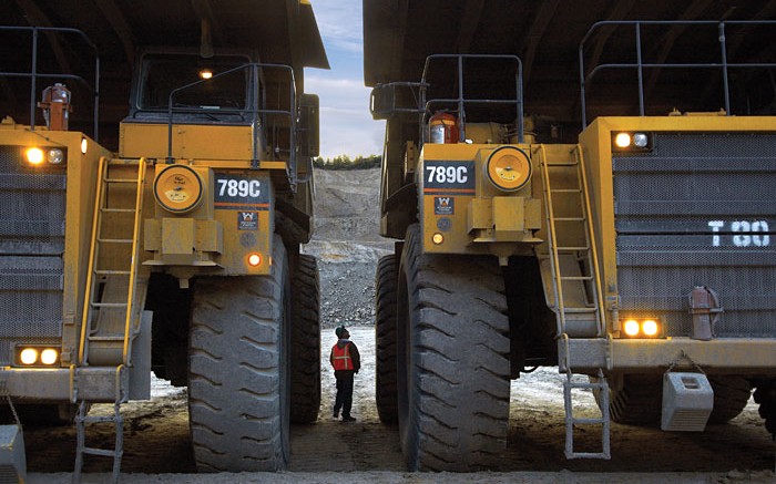 180-tonne haul trucks and driver at the Thompson Creek mine. Source: Thompson Creek Metals