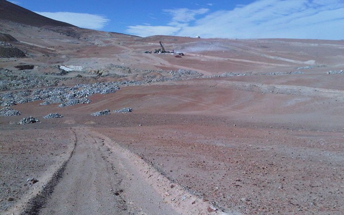 A drill rig in the a distance at Coro Mining's Berta copper project in Chile. Source: Coro Mining