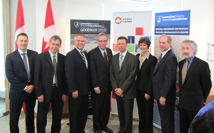 At the funding announcement at Barrick Gold's headquarters in Toronto, from left: Robert Krcmarov, senior vice-president of global exploration, Barrick Gold; Patrice Sawyer, vice-president of research and francophone affairs, Laurentian University; Gary Goodyear, Minister of State for Science and Technology; Joe Oliver, Minister of Natural Resources; Carl Weatherell, executive director and CEO, CMIC; Janet Walden, acting president, NSERC; Michael Lesher, professor and research chair in mineral exploration and principal investigator, Laurentian University; and Francois Robert, vice-president and chief geologist for global exploration, Barrick Gold. Photo by Salma Tarikh.