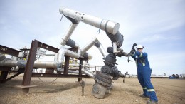 An operator tightens a valve on a steam-assisted gravity drainage well pad at Nexen's Long Lake oilsands project. Source: Nexen
