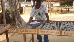 A man studies drill core at Aureus Mining's New Liberty project in Liberia. Source: Aureus Mining