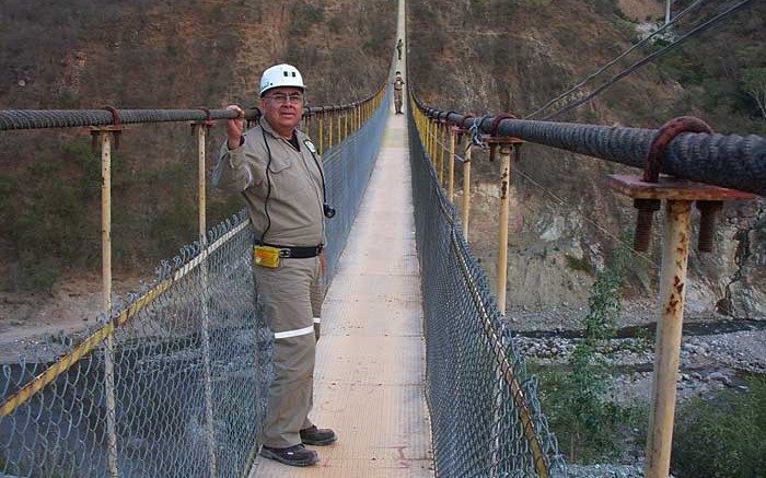 An engineer poses on a suspension bridge at the San Dimas mine. Source: Primero Mining