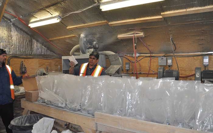 A worker prepares samples at Mega Precious Metals' Monument Bay gold-tungsten project, 570 km northeast of Winnipeg, Manitoba. Source: Mega Precious Metals