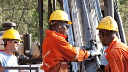 Workers adjust drilling equipment at Amara Mining's  Baomahun project in Sierra Leone (2012). Source: Amara Mining