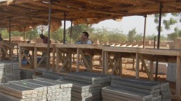 True Gold Mining's chief geologist Chris Lee (centre) examining drill core at the company's facilities near Ouahigouya, Burkina Faso. Source: True Gold Mining