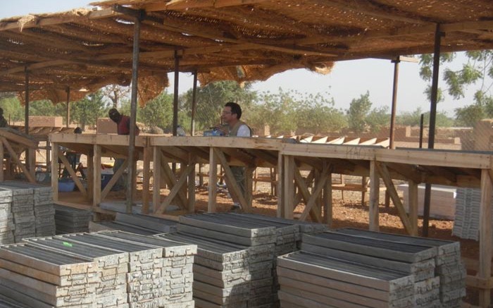 True Gold Mining's chief geologist Chris Lee (centre) examining drill core at the company's facilities near Ouahigouya, Burkina Faso. Source: True Gold Mining