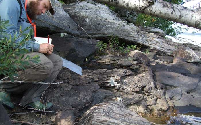 A geologist takes notes at Matamec's Zeus property in Quebec.