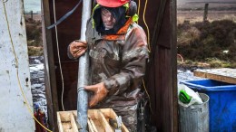 A worker places drill core in a container at Dalradian's Curraghinalt project in Northern Ireland. Credit: Dalradian Resources