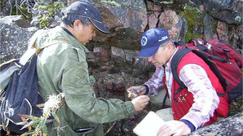 Boen Tan (left), chief geologist, and Richard Mazur, president and CEO of Forum Uranium, examine an outcrop in Saskatchewan's Athabasca basin. Credit: Forum Uranium