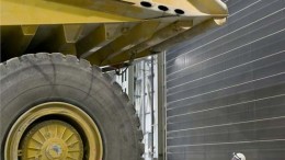 A dump truck dwarfs a worker at Detour Gold's Detour Lake gold mine in northeast Ontario.  Credit: Detour Gold