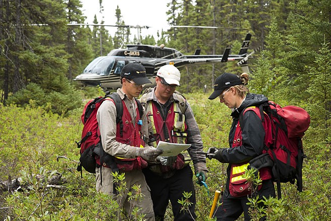 Explorers compare notes at the Detour Lake project. Credit: Detour Gold