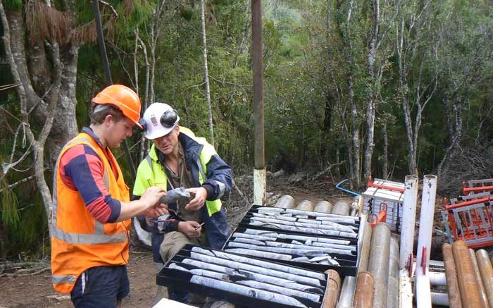 Geologists reviewing core at Antipodes Gold's WKP gold project in New Zealand. Credit: Antipodes Gold