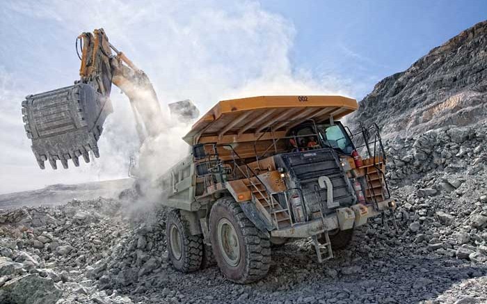 Machines move material in the pit at Primero Mining's Black Fox gold mine in Timmins, Ontario.  Credit: Primero Mining