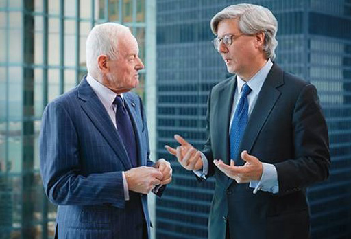 A photo showing Peter Munk (left) in discussion with John Thornton (right) taken from Barrick Gold's 2012 Annual Report. Credit: Barrick Gold