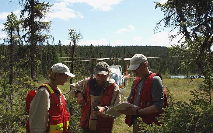 Champion Iron's team discuss plans at the Fire Lake North project in northeastern Qubec.  Credit: Champion Iron