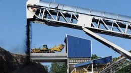 Raw coal is loaded into the plant (background) while clean coal exits the facility on a conveyor at Corsa Coal's Wilson Creek preparation plant in Somerset, Pennsylvania. Credit: Corsa Coal