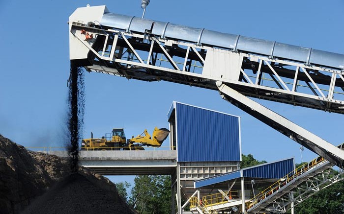 Raw coal is loaded into the plant (background) while clean coal exits the facility on a conveyor at Corsa Coal's Wilson Creek preparation plant in Somerset, Pennsylvania. Credit: Corsa Coal