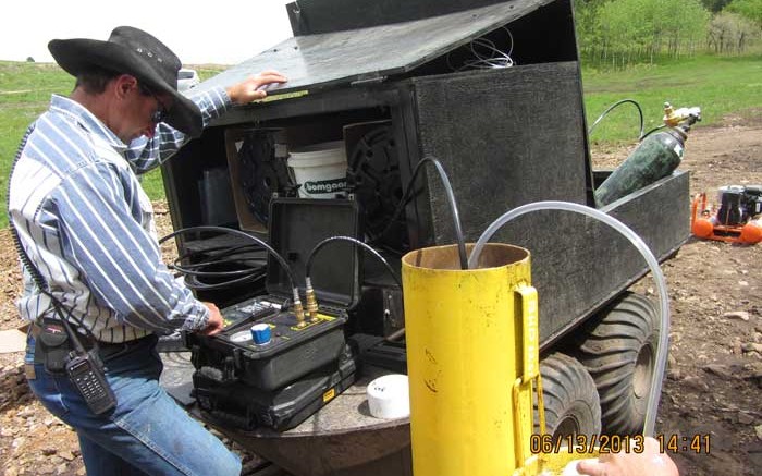 Robbie Grubbs, environmental engineer, collects baseline ground water samples at Rare Element Resources' Bear Lodge REE property, in support of the Wyoming project's environmental impact statement, currently underway. Credit: Rare Element Resources