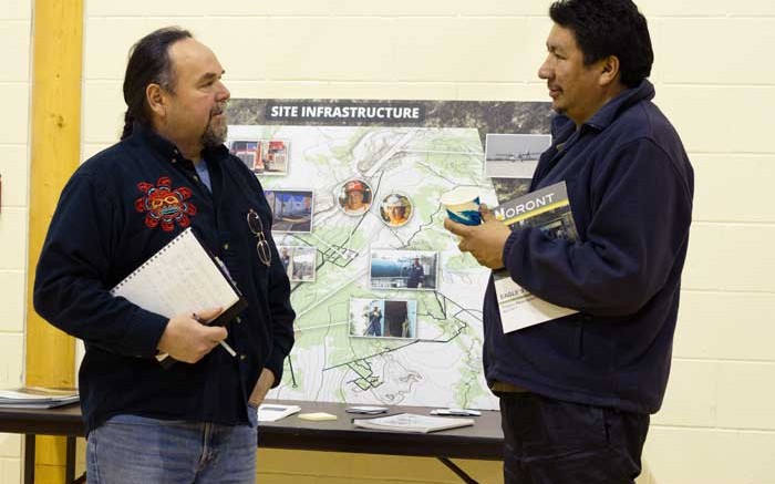 Noront Resources' VP of Aboriginal affairs Glenn Nolan (left) and a local community member discuss proposed infrastructure for the Eagle's Nest nickel-copper-PGM project in Ontario's James Bay Lowlands. Credit: Noront Resources