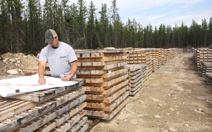 Denison Mines senior project geologist Chad Sorba reviews drill core data at the Wheeler River project in Saskatchewan. Credit: Denison Mines