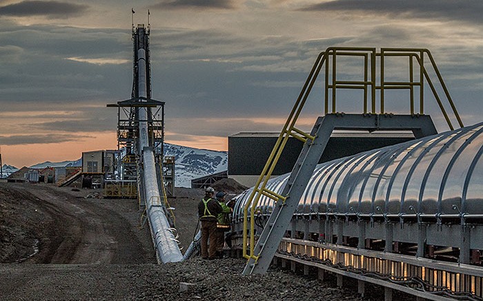 Workers inspect a conveyor at Imperial Metals' Red Chris copper-gold project south of Dease Lake, British Columbia. Credit:  Imperial Metals