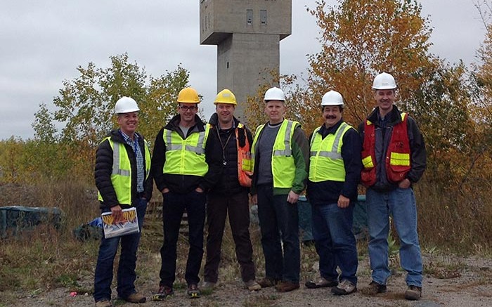 At Pure Gold Mining's historic Madsen gold property in northwestern Ontario, from left: Darin Labrenz, president and CEO; Blaine Monaghan, director of investor relations; Phil Smerchanski, director of geoscience; Sean Tetzlaff, CFO; Lenard Boggio, director; and Darren O'Brien, vice-president of exploration.  Photo by Matthew Keevil.