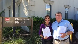 Romarco Minerals president and CEO Diane Garrett and COO Jim Arnold show off their Section 404 permit, which was granted in October for the Haile gold project in South Carolina. Credit: Romarco Minerals