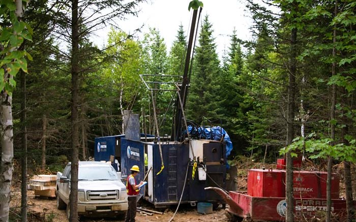 A worker stands at a drill site this summer at Trevali Mining's Stratmat zinc-lead-silver-copper-gold project, 45 km southwest of Bathurst, New Brunswick. Credit: Trevali Mining