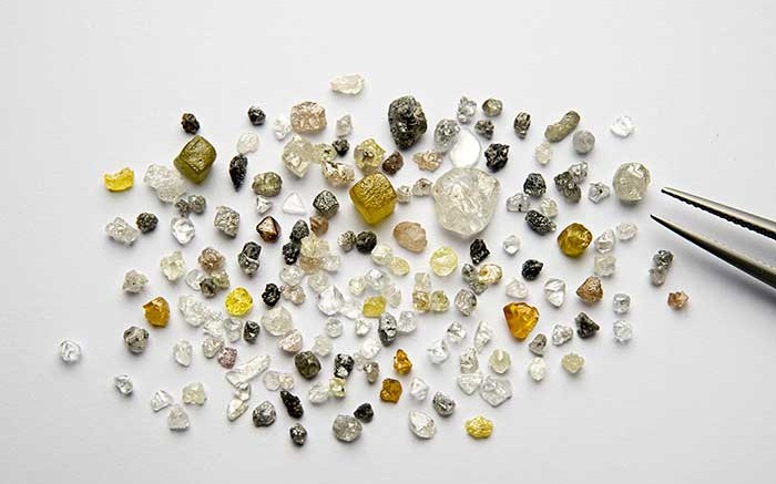 A representative "run of mine" from a portion of Q1-4 kimberlitic bulk sample totaling 17.22 carats. The largest white diamond is 1.52 carats and the largest yellow diamond is 1.17 carats. Credit: North Arrow Minerals