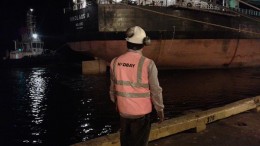 A worker watches the first load of concentrate from Hudbay Minerals' Constancia copper-moly-gold-silver mine leave for China from Peru. Credit: Hudbay Minerals