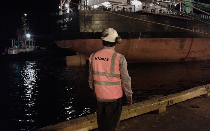 A worker watches the first load of concentrate from Hudbay Minerals' Constancia copper-moly-gold-silver mine leave for China from Peru. Credit: Hudbay Minerals