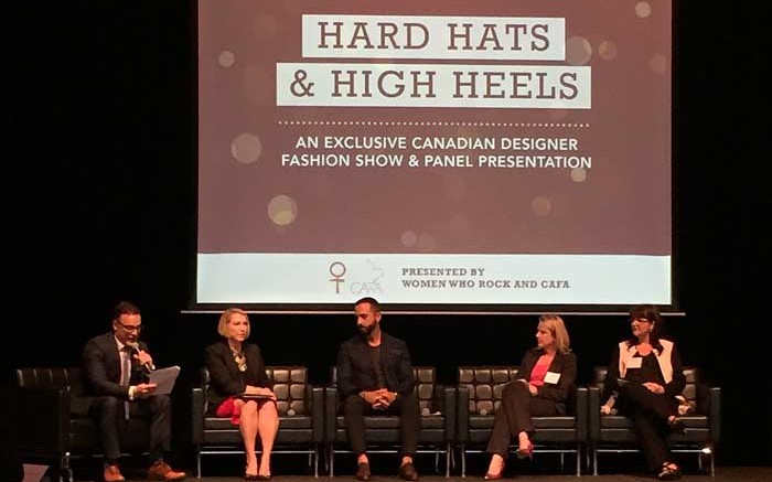 The Northern Miner's publisher Anthony Vaccaro (far left) moderates a panel  at the Hard Hats & High Heels fashion show. Panelists (from left to  right) included Holt Renfrew's vice president of exclusive services Lisa Tant, Fashion Magazine's contributing fashion editor George Antonopoulos,   Kinross Gold's senior vice president of human resources Gina Jardine, and one of PwC Canada's partners Marelize Konig. Source: Women Who Rock