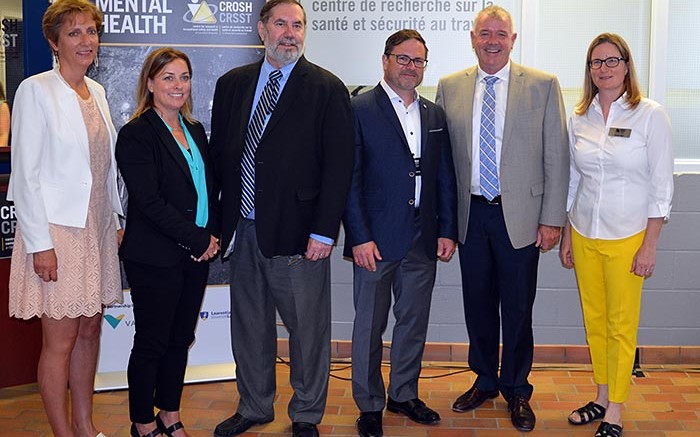 At the announcement event for the mental health in mining research project in Sudbury, from left: France Glinas, MPP for Nickel Belt; Jody Kuzenko,director of Vale's Ontario production services; Leo Gerard, international president of the United Steelworkers; Michel Larivire, clinical psychologist and associate director at CROSH; Kevin Daniel Flynn, Ontario Minister of Labour; and Tammy Eger, research chair in occupational health and safety.  Source: Laurentian University