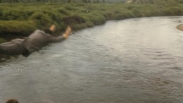 Moments from the Toodoggone River Tube Race on July 31, 1981.  Vic Hardy tests the water to begin the race.