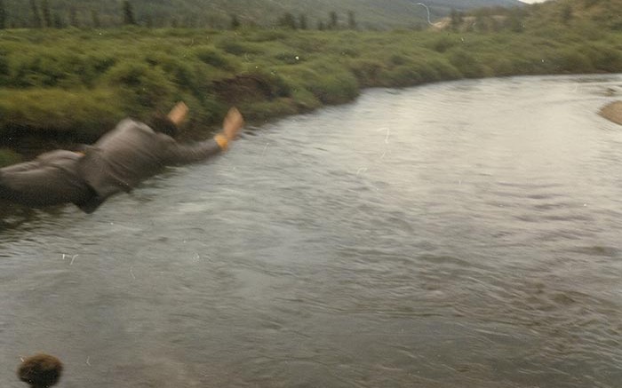 Moments from the Toodoggone River Tube Race on July 31, 1981.  Vic Hardy tests the water to begin the race.