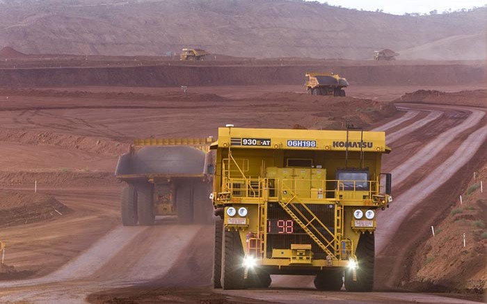 Autonomous haulage trucks on the move at Rio Tinto's West Angelas iron ore mine in Australia's Pilbara region. Credit: Rio Tinto.