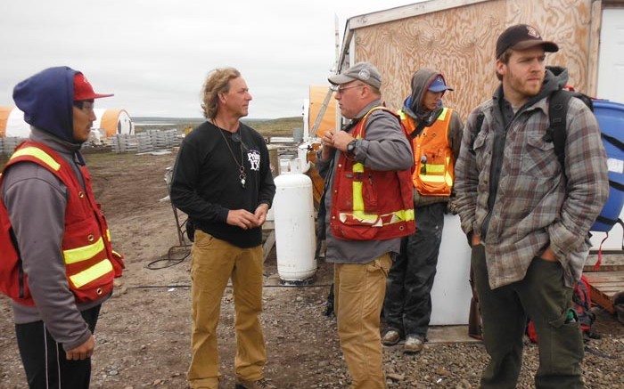 Northquest CEO Jon North (second from left) with colleagues at the Pistol Bay gold project, near the town of Whale Cove in eastern Nunavut. Credit: Northquest