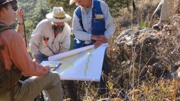 Geologists examine a map at Almaden Minerals' Ixtaca epithermal gold-silver deposit 95 km  north of Puebla City, Mexico. Credit: Almaden Minerals