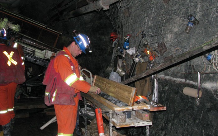 A geologist examines drill core in early 2015 on a drill platform 244 metres below the surface at Rubicon Minerals' Phoenix F2 gold deposit in northwestern Ontario. Credit: Rubicon Minerals