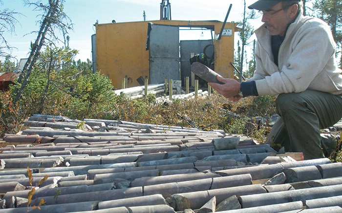 Moe Lavigne, KWG Resources' vice-president of exploration and development, inspects core in 2010 at the Big Daddy chromite deposit in Ontario. Credit: WG Resources