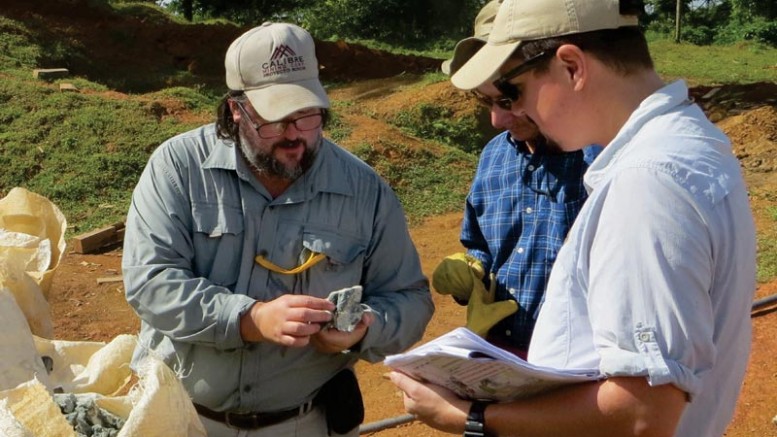 Examining gold-silver samples at the Guapinol discovery on the Eastern Borosi property, from left: Greg Smith, Calibre Mining president and CEO; Robert Page, Iamgold director of exploration; and Marc Cianci, Calibre senior project geologist.  Credit: Calibre Mining