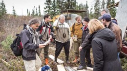Sirios Resources president and CEO Dominique Doucet (far left) examines a core sample during a site visit to the Cheechoo gold project, 320 km north of Matagami, Quebec, in 2014. Credit: Sirios Resources.