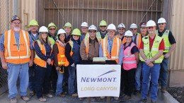 Members of Newmont Mining’s Long Canyon team pose with one of the first gold bars produced at the mine in Elko County, Nevada. Credit: Newmont Mining.